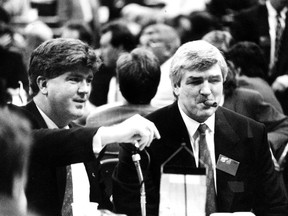 June 1990 photo of Vancouver Canucks coach Pat Quinn (smoking cigar on the right) with Brian Burke.