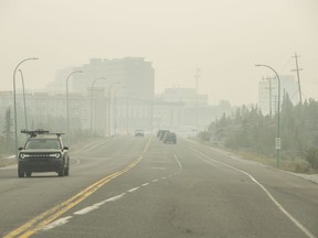 Heavy smoke from nearby wildfires fills the sky in Yellowknife, Tuesday, Aug. 15, 2023.