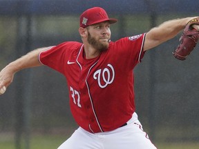 FILE - Washington Nationals pitcher Stephen Strasburg throws live batting practice in a drizzle during the team's spring training baseball workout March 15, 2022, in West Palm Beach, Fla. Nationals pitcher Stephen Strasburg has decided to announce his retirement, ending a career that began as a No. 1 draft pick, included 2019 World Series MVP honors and was derailed by injuries, according to a person with knowledge of the situation. The person spoke to The Associated Press on condition of anonymity Thursday because Strasburg has not spoken publicly about his plans.