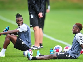 Sam Adekugbe and Richie Lareya, all smiles at practice.