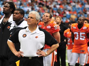 Wally Buono and the B.C. Lions watch a post-game tribute to Bobby Ackles at B.C. Place on July 18, 2008.