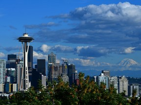 A general view of the Seattle Space Needle and downtown skyline with Mount Rainier in the background