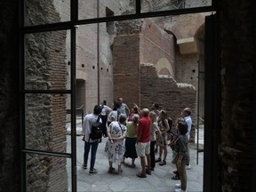 Visitors admire the newly restored domus Tiberiana, one of the main imperial palaces, during the press preview on Rome's Palatine Hill, in Rome, Italy, Wednesday, Sept. 20, 2023.