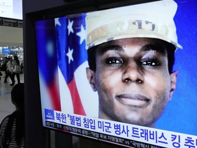 A TV screen shows a file image of American soldier Travis King during a news program at the Seoul Railway Station in Seoul, South Korea, Wednesday, Sept. 27, 2023.