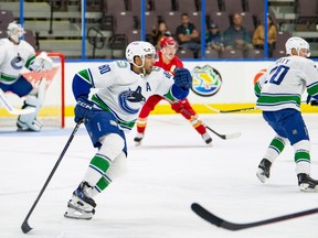 Vancouver Canucks forward prospect Arshdeep Bains skates against the Calgary Flames at the Young Stars tournament in Penticton on Friday, Sept. 15, 2023.