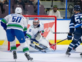 Vancouver Canucks defenceman Hunter Brzustewicz and goaltender Ty Young in action against the Winnipeg Jets at the Young Stars tournament in Penticton on Sunday, Sept. 17, 2023.