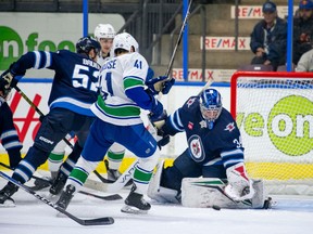 Vancouver Canucks defenceman Akito Hirose has his shot stopped against the Winnipeg Jets at the Young Stars tournament in Penticton on Sunday. Hirose led the tournament with five points (1G, 4A) in three games.