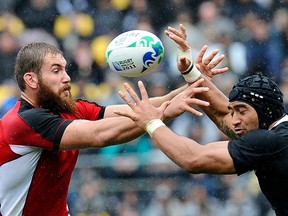 Canada's lock Jebb Sinclair (L) vies with New Zealand All Black flanker Victor Vito during the 2011 Rugby World Cup pool A match New Zealand vs Canada at the Wellington Regional Stadium in Wellington on October 2, 2011.