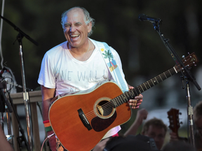 Jimmy Buffett performs at his sister’s restaurant in Gulf Shores, Ala., on June 30, 2010.