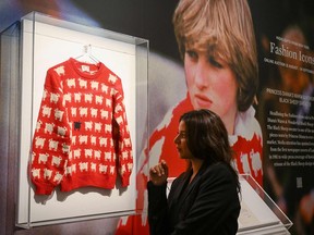 The "Black Sheep Jumper" designed by Sally Muir and Joanna Osborne and worn on several occasions by Britain's late Princess Diana is seen on display at Sotheby's auction house in London on July 17, 2023.