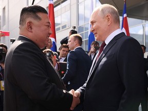 North Korea's leader Kim Jong Un shakes hands with Russia's President Vladimir Putin during their meeting at the Vostochny Cosmodrome in Russia on September 13, 2023.