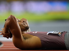 Andre De Grasse of Markham, Ont., looks up at the scoreboard after finishing a men's 200-metre semifinal during the World Athletics Championships in Budapest, Hungary, Thursday, Aug. 24, 2023.