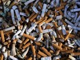 The governments of British Columbia, Ontario and Newfoundland and Labrador lost up to $2.47 billion in tax revenues over four years due to the growth in illegal tobacco sales, says a convenience industry report. Cigarette butts fill a smoking receptacle outside a federal building in Washington, Thursday, April 15, 2021.