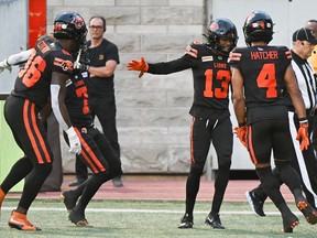 B.C. Lions wide receiver Alexander Hollins (13) celebrates with teammates after scoring a touchdown against the Montreal Alouettes during first half CFL football action in Montreal, Saturday, September 2, 2023.