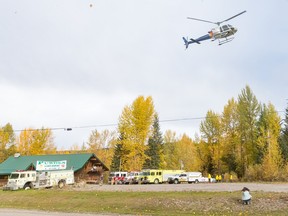 A police helicopter takes off from a staging area at Purden Lake Resort near the site of a helicopter crash, east of Prince George, B.C., on Tuesday, Sept. 26, 2023.