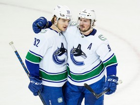 Vancouver Canucks' J.T. Miller (9) celebrates with Vasily Podkolzin (92) after Podkolzin scored a goal during the second period of an NHL hockey game against the New York Rangers Wednesday, Feb. 8, 2023, in New York.