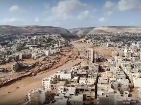 This image grab from footage published on social networks by Libyan al-Masar television channel on Sept. 13 shows an aerial view of a extensive damage in the wake of floods after the Mediterranean storm "Daniel" hit Libya's eastern city of Derna.