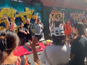 A block party in the alley beside 218 Keefer Street was organized by SRO Collective and drew dozens of people, including former single-room occupancy tenants of Keefer Rooms and patrons of Gain Wah restaurant.
