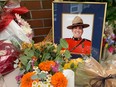 A memorial has been set up at the Ridge Meadows RCMP Detachment for 51-year-old Const. Rick O'Brien, who was killed in tthe line of duty Friday. Photo: Jason Payne/PNG