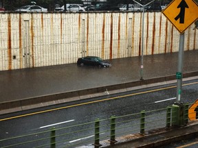 A vehicle sits submerged after it got stuck in high water on the Prospect Expressway during heavy rain and flooding on Sept. 29, 2023 in the Brooklyn Borough of New York City.