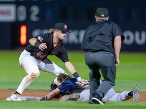 A Vancouver Canadians player tags a player out on Saturday night at Nat Bailey Stadium as the Canadians beat the Everett AquaSox 10-2 to capture the best-of-five Northwest League finale in four games.