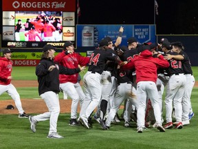The Vancouver Canadians celebrate wining the Northwest League title Saturday night at Nat Bailey Stadium. It's the franchise's fifth crown since 2011.