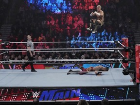 Wrestler Akira Tozawa goes airborne during his match with Carmelo Hayes during the WWE Monday Night RAW event, Monday, March 6, 2023, in Boston. WWE's popular television show, "Friday Night Smackdown," will be moving from Fox to USA Network next year under a new five-year domestic media rights partnership with NBCUniversal, Thursday, Sept. 21, 2023. "Smackdown" will begin airing on USA Network in October 2024.