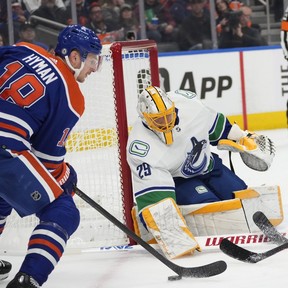 Edmonton Oilers Zach Hyman (18) can't get the puck past Vancouver Canucks goalie Casey DeSmith (29) during first period NHL preseason action on Wednesday, Sept. 27, 2023 in Edmonton. Greg Southam-Postmedia