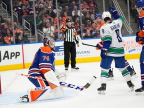 Vancouver Canucks Conor Garland (8) celebrates his team's goal Edmonton Oilers goalie Stuart Skinner (74) on during second period NHL pre-season action on Wednesday, Sept. 27, 2023 in Edmonton.