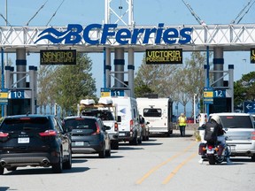 Passengers waiting to board a ferry at the B.C. Ferries Tsawwassen terminal in Delta.