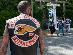 There's a heavy police presence as Hells Angels and associates arrive at the motorcycle club's White Rock clubhouse in Langley, BC Saturday, July 22, 2023.