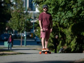 Mahyar Saeedi, founder of the Vancouver ESK8 personal electric vehicle and e-ride enthusiasts group, with his electric motorized longboard, in Coquitlam, BC Thursday, September 14, 2023. There is lack of consistent rules for e-scooters and PEV throughout the Lower Mainland, something that concerns Saeedi (Photo by Jason Payne/ PNG)