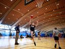 Pasha Bains, co-founder DRIVE sports club, watches his students do layups January 27 at the Richmond Oval in Richmond, British Columbia, Canada.