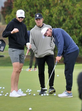 J.T. Miller (r) in action during the Jake Milford Canucks Charity Invitational Golf Tournament at the Northview Golf and Country Club in Surrey, B.C. on September 18, 2023.