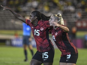 Canada's Nichelle Prince, left, celebrates her goal against Jamaica with teammate Adriana Leon during a CONCACAF women's championship soccer series match in Kingston, Jamaica, Friday, Sept. 22, 2023.