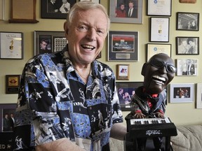 Red Robinson in 2009 with memorabilia from over the years, including this Ray Charles animated doll.