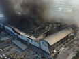 An aerial view shows smoke billowing from a factory after a fire in Pingtung, southern Taiwan on Sept. 23, 2023.