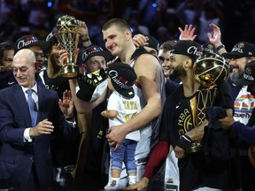 Nikola Jokic of the Denver Nuggets is presented the Bill Russell NBA Finals Most Valuable Player Award after his team's 94-89 victory against the Miami Heat in Game 5 of the 2023 NBA Finals to win the NBA Championship at Ball Arena on June 12, 2023 in Denver, Colorado.