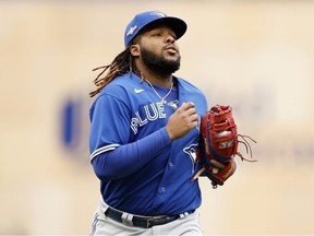 Vladimir Guerrero Jr. of the Toronto Blue Jays takes the field against the Minnesota Twins during the first inning in Game Two of the Wild Card Series at Target Field on October 04, 2023 in Minneapolis, Minnesota.