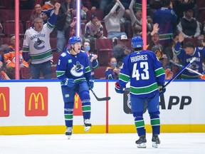 Brock Boeser celebrates after scoring his second goal during the second period on Wednesday night at Rogers Arena