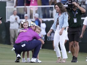 Luke List of the U.S. celebrates with wife Chloe, daughter Ryann and son Harrison after winning the Sanderson Farms Championship at The Country Club of Jackson on Sunday, Oct. 8, 2023, in Jackson, Miss.