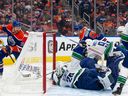 Casey DeSmith made 37 saves Saturday night, helping the Vancouver Canucks to a 4-3 win over the Edmonton Oilers.