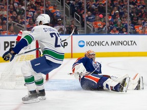 Goaltender Stuart Skinner can't stop Jack Studnicka from scoring a goal during the second period at Rogers Place on Saturday night.