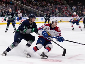Edmonton Oil Kings' Jalen Luypen (23) battles Seattle Thunderbirds' Sawyer Mynio (43) during second period WHL Championships action at Rogers Place in Edmonton, on Friday, June 3, 2022.