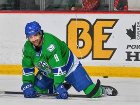 Abbotsford Canucks forward Arshdeep Bains (centre) gets ready ahead of a game against the Colorado Eagles at the Abbotsford Centre on Sunday, March 12 2023.