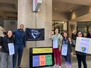 Toronto Raptors guard and vice-president of the National Basketball Players' Association Garrett Temple, second from left, showing support for members of the SFU Teaching Support Staff Union, who are on strike. The Raptors' players, who are in Vancouver for training camp, also made a $10,000 donation to the TSSU's strike fund on Friday.