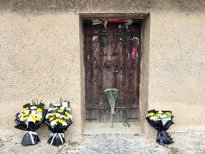 Flowers are seen left in front of the former house of former Chinese premier Li Keqiang in Dingyuan county, Chuzhou city, in China's eastern Anhui province on October 27, 2023.