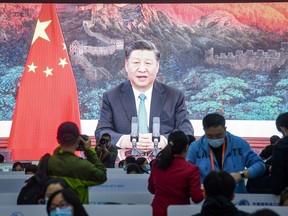A screen shows Chinese President Xi Jinping delivering a speech by video for the opening ceremony of the third China International Import Expo (CIIE) at a media centre in Shanghai on Nov. 4, 2020.