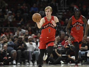 Toronto Raptors guard Gradey Dick dribbles the ball during the second half of a pre-season NBA basketball game against the Chicago Bulls, Tuesday, Oct. 17, 2023, in Chicago. In his first ever NBA pre-season, Dick promised himself to put in long hours at the Toronto Raptors' training facilities and do whatever his coaches asked of him.