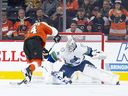 Flyers' Sean Couturier takes a penalty shot against Canucks' Thatcher Demko during Tuesday's game in Philadelphia.